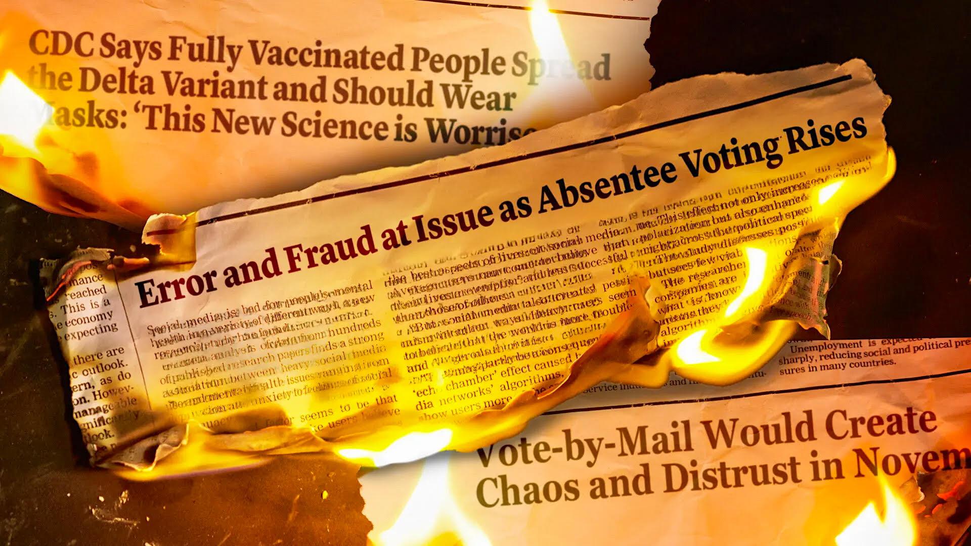 Scraps of newspaper articles are shown burning.