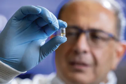 man holding a pill
