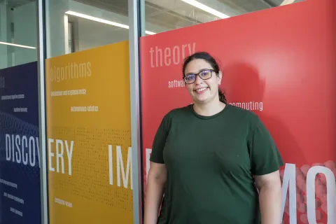 Julia Mendelsohn in green shirt and glasses