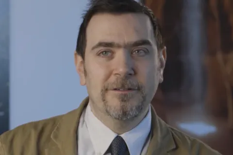 A headshot of David Broniatowski