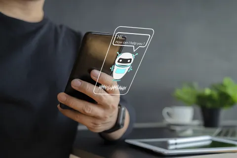 photo of someone using a smartphone to speak to an AI agent