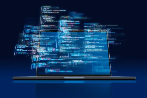 Laptop with programming code on its screen