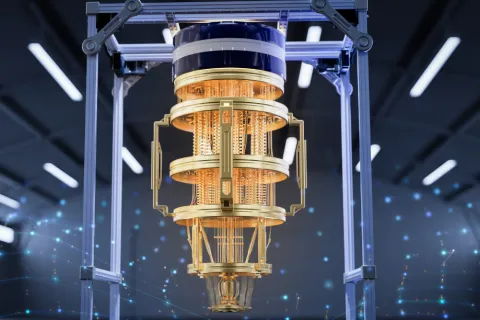 Quantum computer with a cylindrical, gold-colored processor suspended in a high-tech laboratory environment