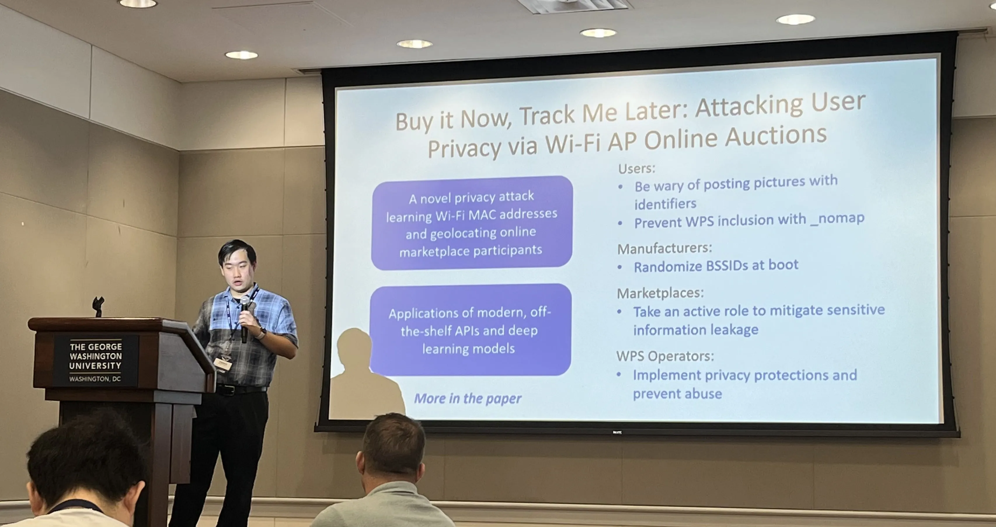 Student giving a research presentation to a room