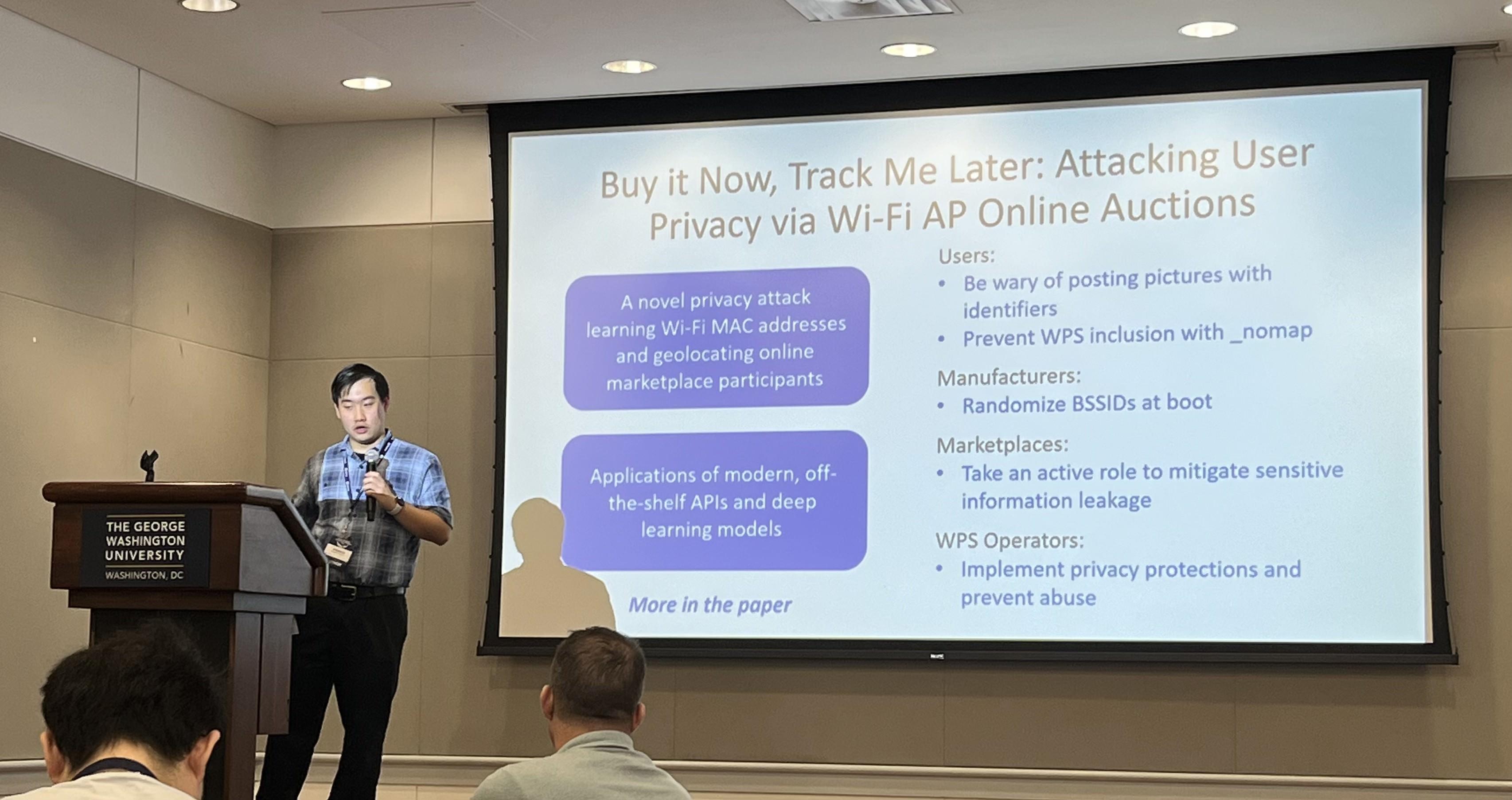 Student giving a research presentation to a room