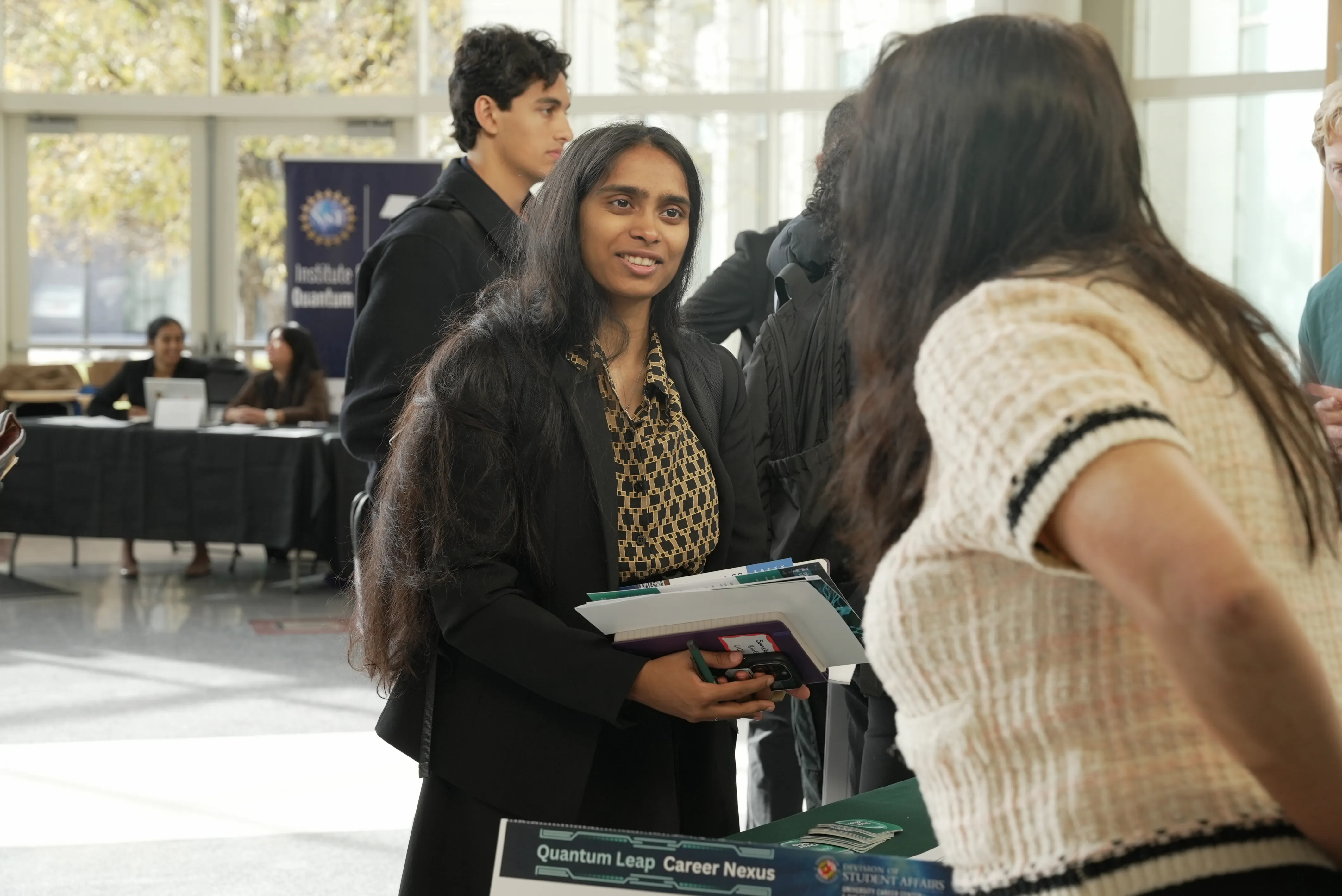 woman smiling with RQS logo in background