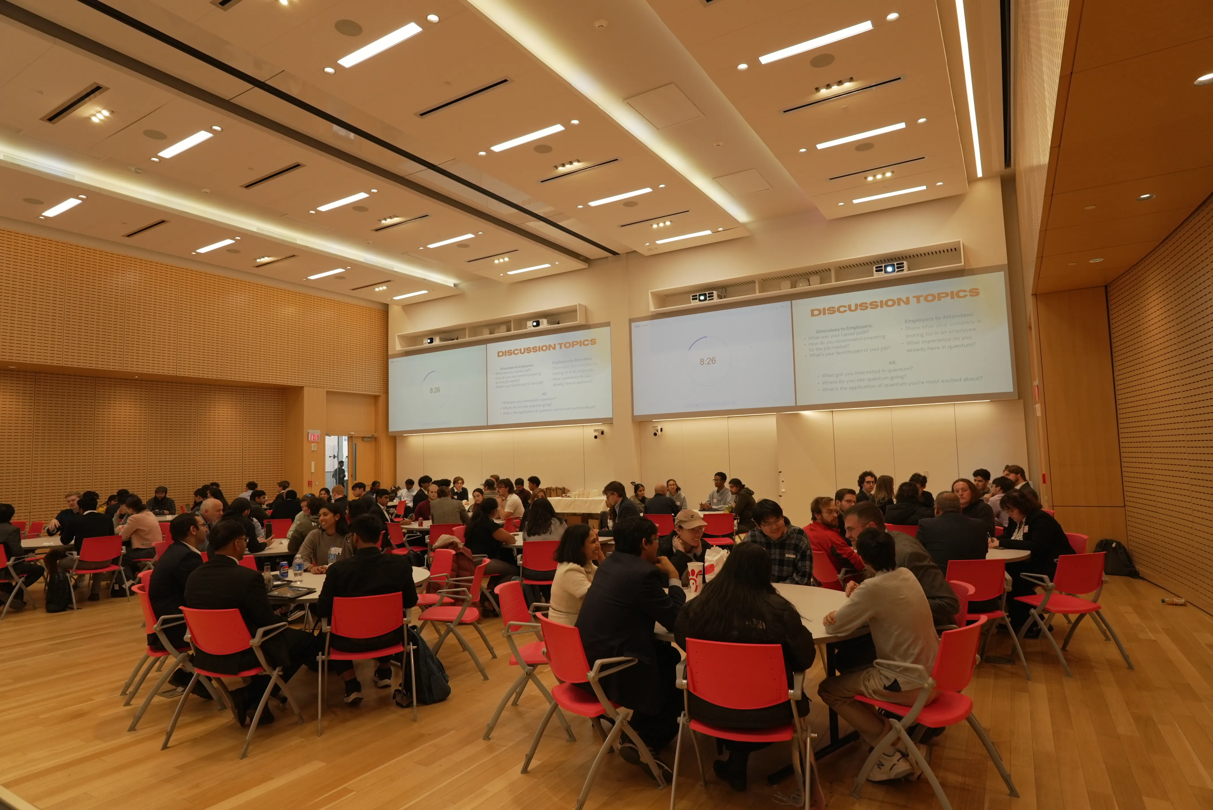 roundtable discussions in orange chairs