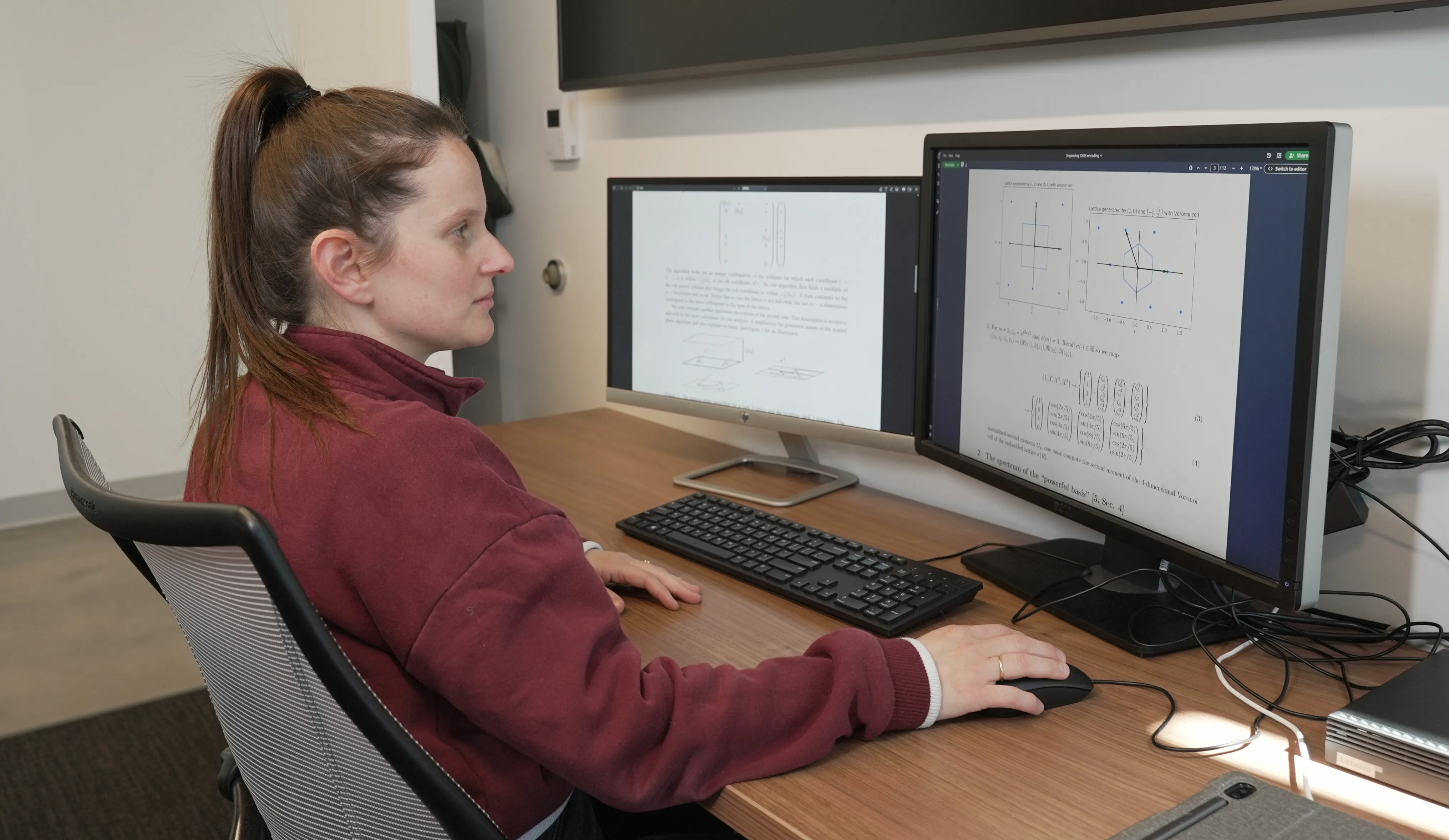 Natalie Lang working on computers