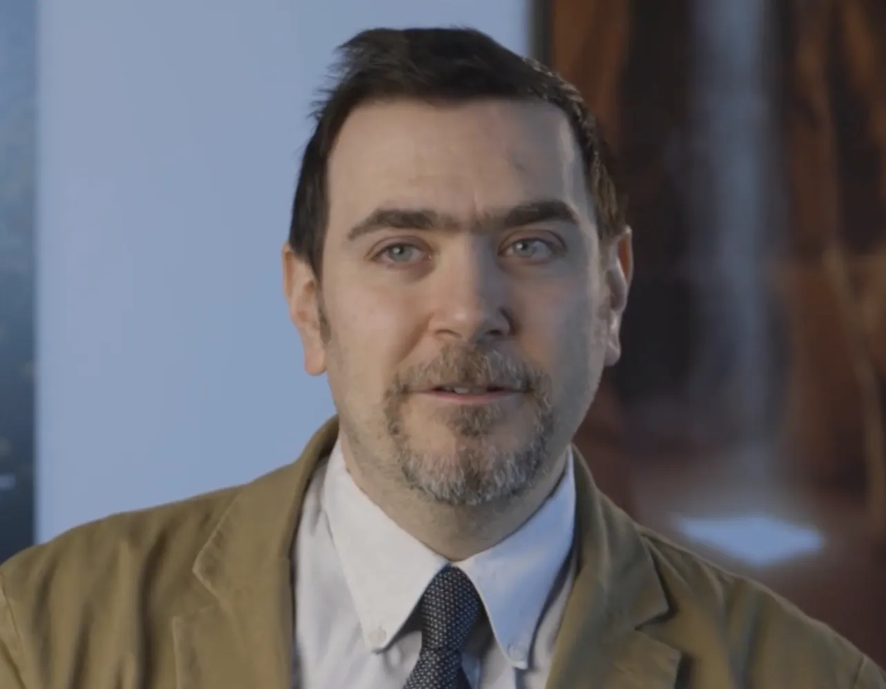 A headshot of David Broniatowski