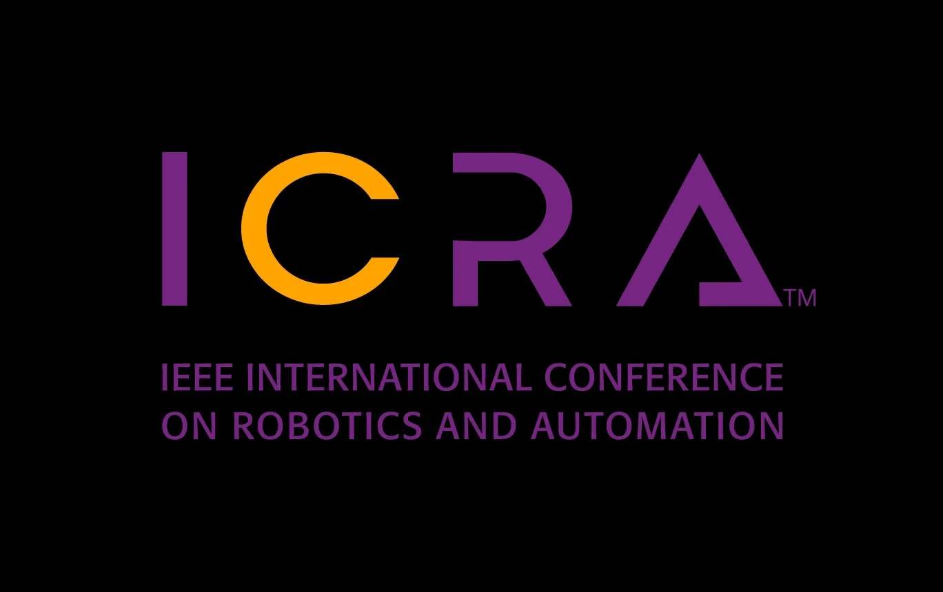 Logo for ICRA (IEEE International Conference on Robotics and Automation) featuring stylized purple and orange text on a black background.