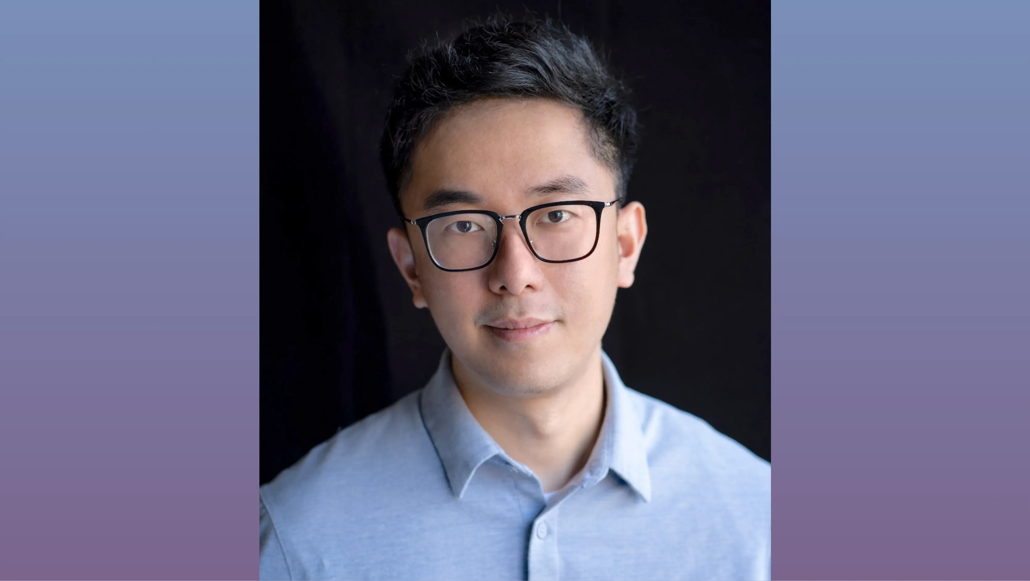 A headshot of Alan Liu. He wears glasses and a light blue collared shirt.