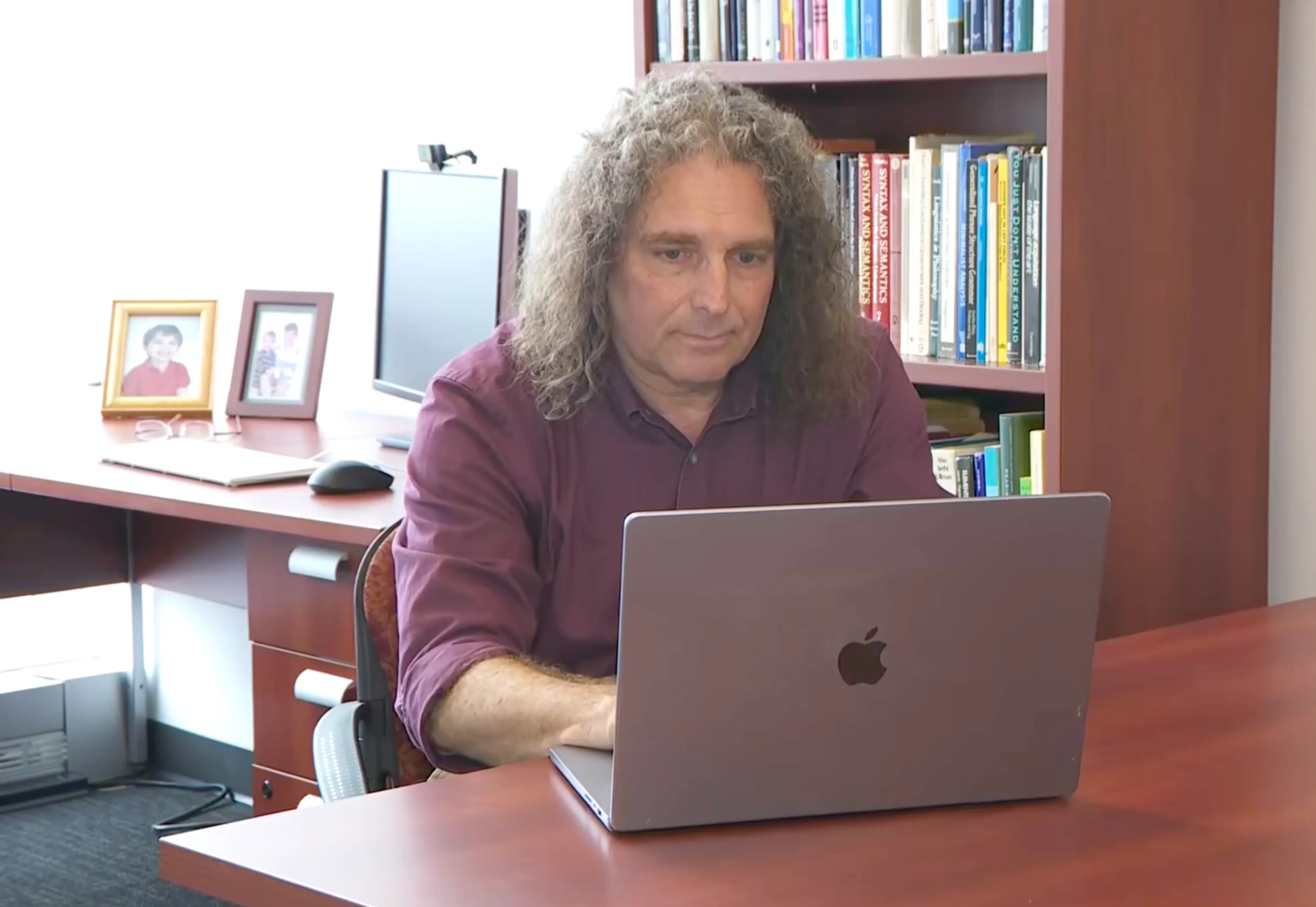 Philip Resnik sits at desk with laptop